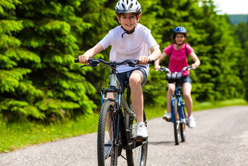 Mother and son riding bikes. Mother and son riding bikes