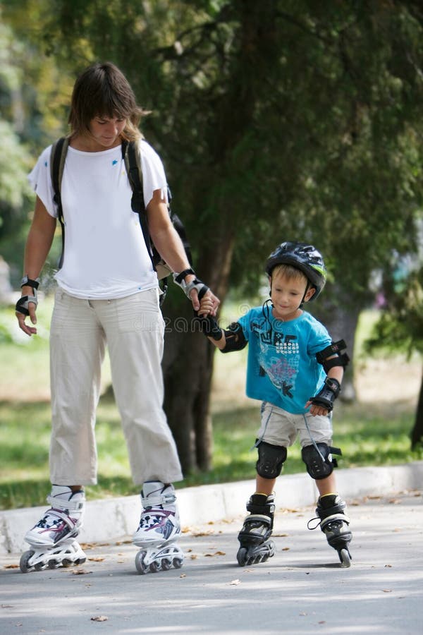 Mother and son rollerskating