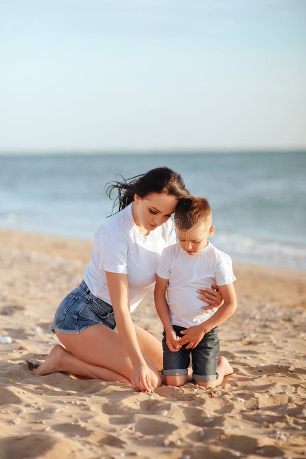 Mother and son on the beach. 