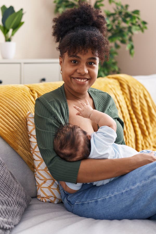 Mother and Son Sitting on Sofa Breastfeeding at Home Stock Photo Image of adult, woman 269147718