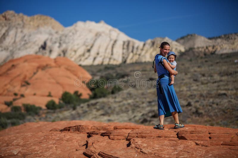 Mother and son on a trail in volcanic Snow canyon State Park in