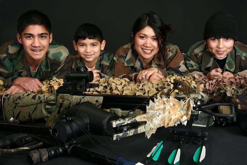 Beautiful Filipino woman and her three sons in camo and hunting gear. Beautiful Filipino woman and her three sons in camo and hunting gear.