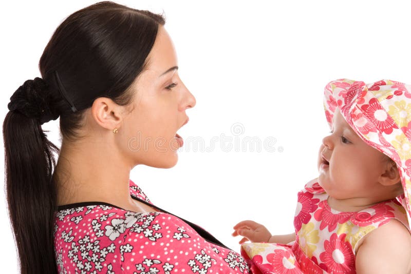A mother teaches his daughter to speak stock image