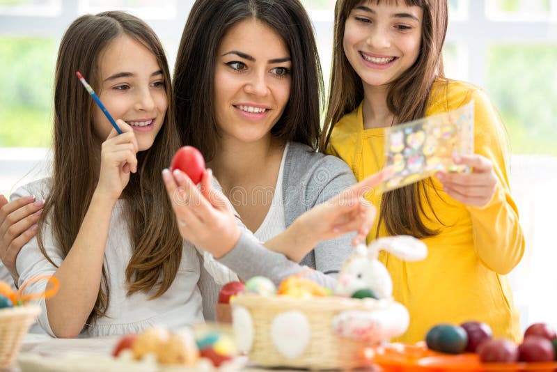 Mother and two girls making Easter decoration royalty free stock image Mother and two girls making Easter decoration royalty free stock image