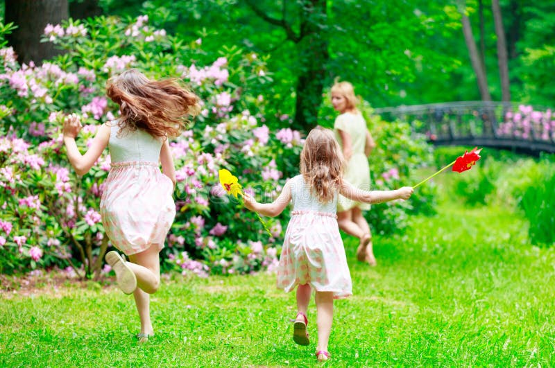 Mother and two sisters running and hiding