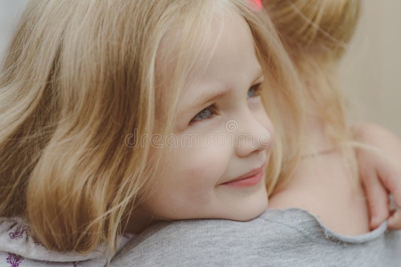 Mothers day. Little girl embrace her mother. Childrens day. Small baby girl. Love in family. Childhood. New life concept stock image Mothers day. Little girl embrace her mother. Childrens day. Small baby girl. Love in family. Childhood. New life concept stock image