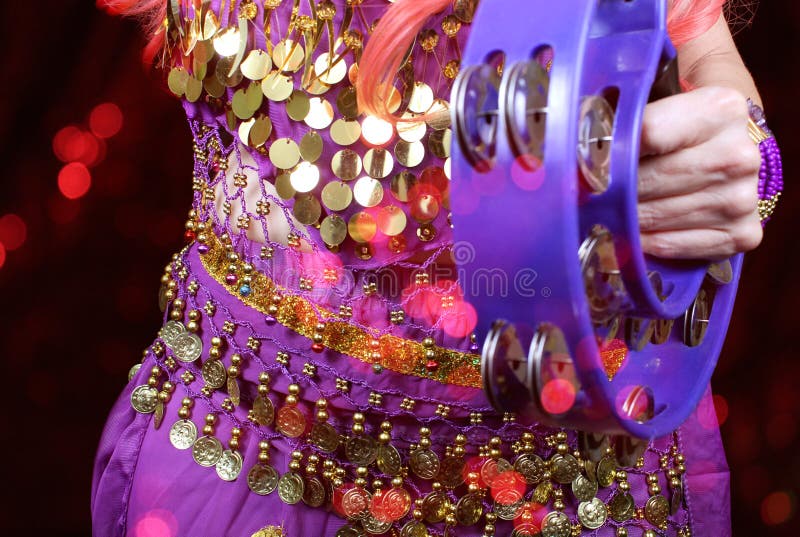 Belly Dancer Wearing Purple Dance Costume Close Up with Bokeh Stock
