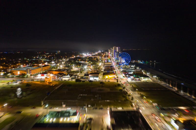 Motion Blur Flying Approach Myrtle Beach at Night City Lights Stock