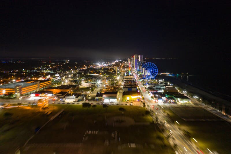 Motion Blur Flying Approach Myrtle Beach at Night City Lights Stock