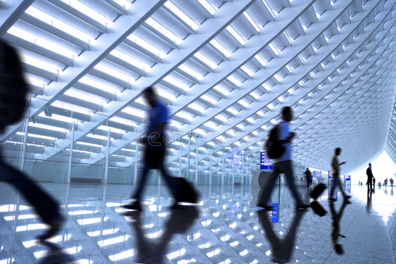 Motion blurred commuters At the airport stock photography