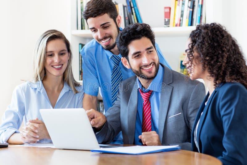 Motivated multi ethnic team of male and female business trainees royalty free stock photography