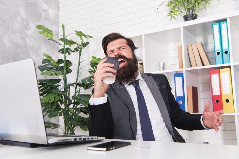 Motivational music. Stress resistance concept. Accountant insurance agent relaxing with favorite music. Successful stock photos Motivational music. Stress resistance concept. Accountant insurance agent relaxing with favorite music. Successful stock photos