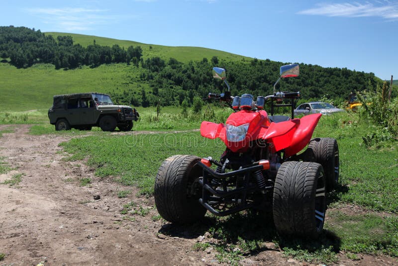 A jeep and a grassland motorcycle. A jeep and a grassland motorcycle
