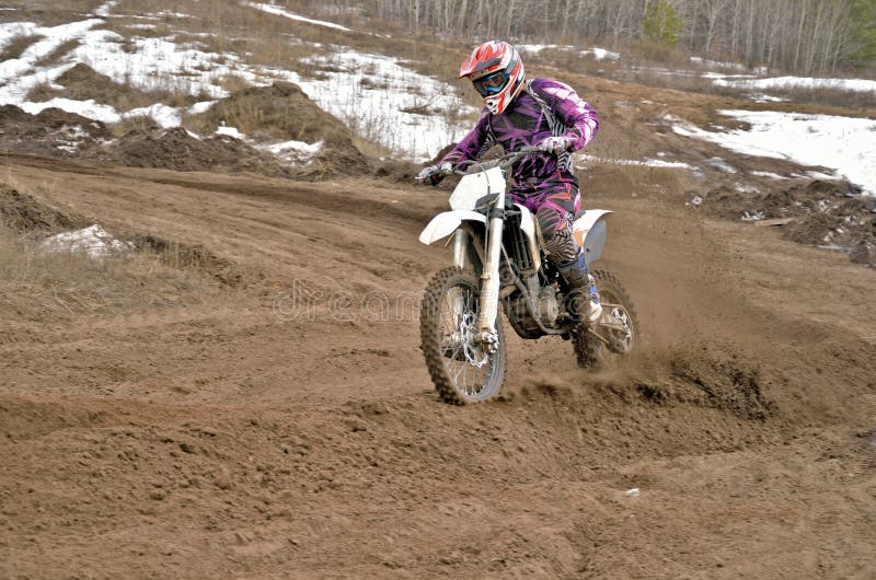 Motocross rider on a motorcycle rides cornering royalty free stock image Motocross rider on a motorcycle rides cornering royalty free stock image