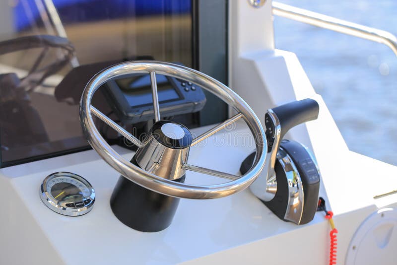 Motor Boat Steering Wheel and Dashboard with Navigation Devices Stock