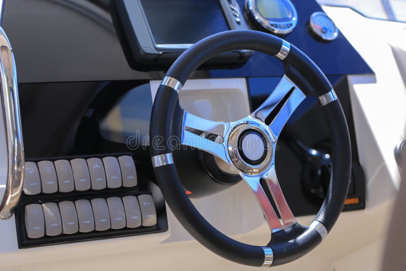 Motor Boat Steering Wheel and Dashboard with Navigation Devices Stock