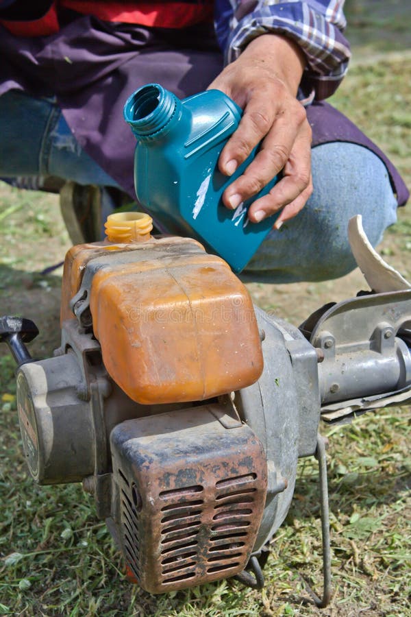 Motor oil tank stock photo. Image of bottle, hands, tank 31625262