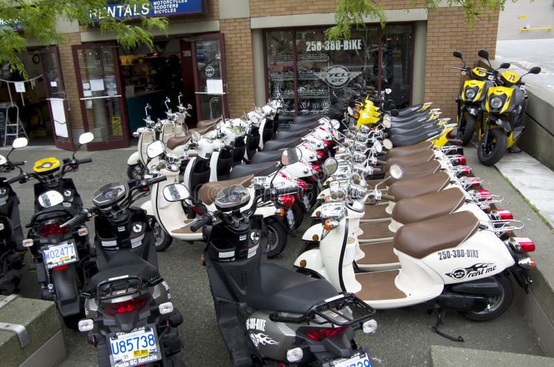 Motor scooters shop editorial photography. Image of motorcycle 54873482