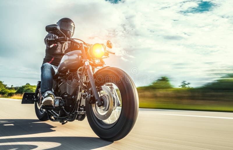 Motorbike on the road riding. having fun riding the empty road o stock photos Motorbike on the road riding. having fun riding the empty road o stock photos