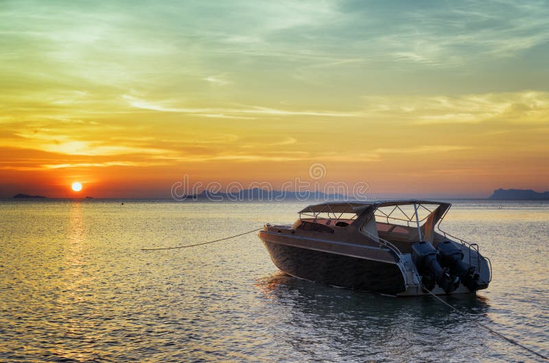 Motorboat at sunset. Beautiful landscape royalty free stock photo