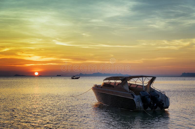 Motorboat at sunset. Beautiful landscape royalty free stock photos