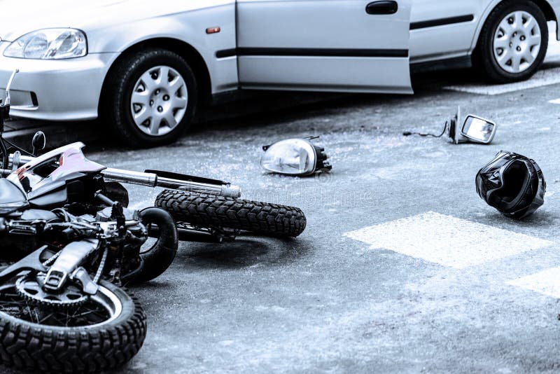 Motorcycle and car after terrible accident on the road