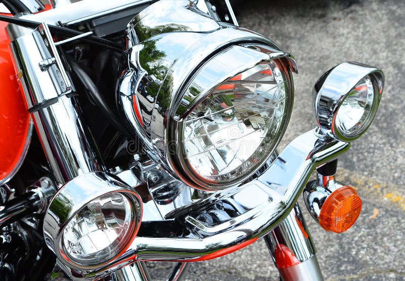 Motorcycle headlight chrome and orange. Harley Davidson. Motorcycle headlight chrome and orange. Harley Davidson.