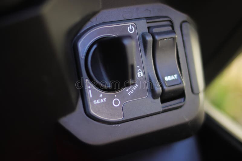 Motorcycle ignition to illustrating security. Close-up view of motorcycle key ignition switch starter