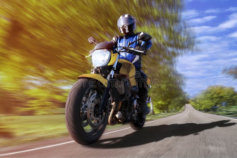 Motorcyclist on country road accelerating to take over royalty free stock image Motorcyclist on country road accelerating to take over royalty free stock image