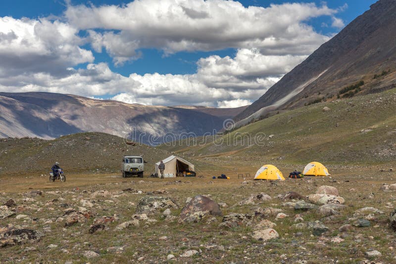 Motorcyclist near tourist camping on the Mongolian steppes, Altai. Motorcyclist near tourist camping on the Mongolian steppes, Altai.