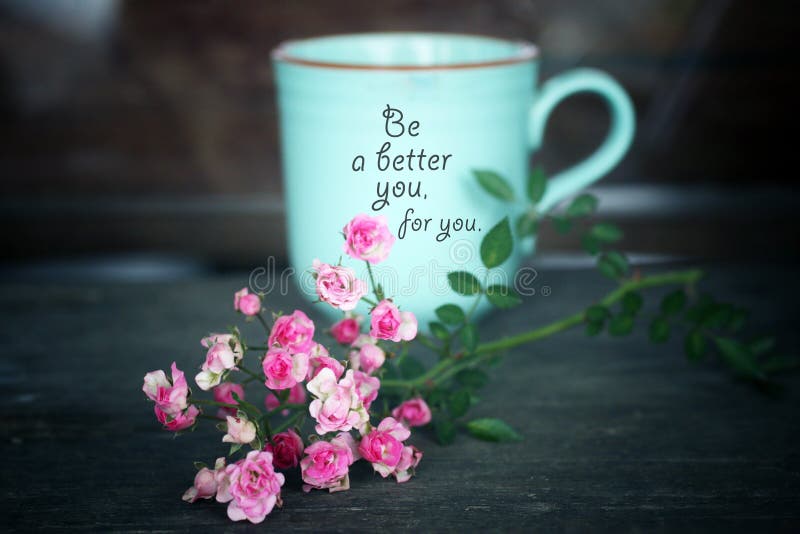 Inspirational words - Be a better you, for you. Self care and love motivational quote written on a green cup of morning coffee or tea with little pink roses on the table vintage background. Inspirational words - Be a better you, for you. Self care and love motivational quote written on a green cup of morning coffee or tea with little pink roses on the table vintage background