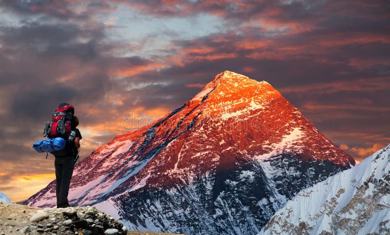 Mount Everest from Gokyo valley with tourist. Evening colored view of Mount Everest from Gokyo valley with tourist on the way to Everest base camp, Sagarmatha royalty free stock photography Mount Everest from Gokyo valley with tourist. Evening colored view of Mount Everest from Gokyo valley with tourist on the way to Everest base camp, Sagarmatha royalty free stock photography