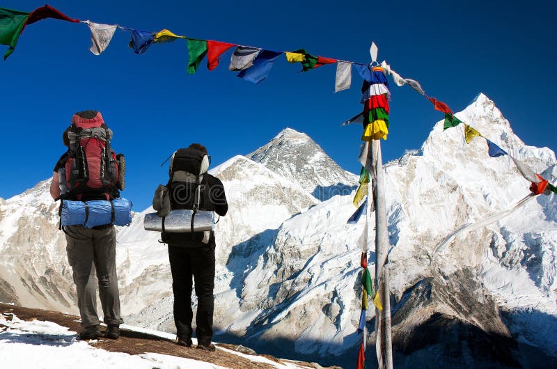 Mount Everest with tourists and prayer flags