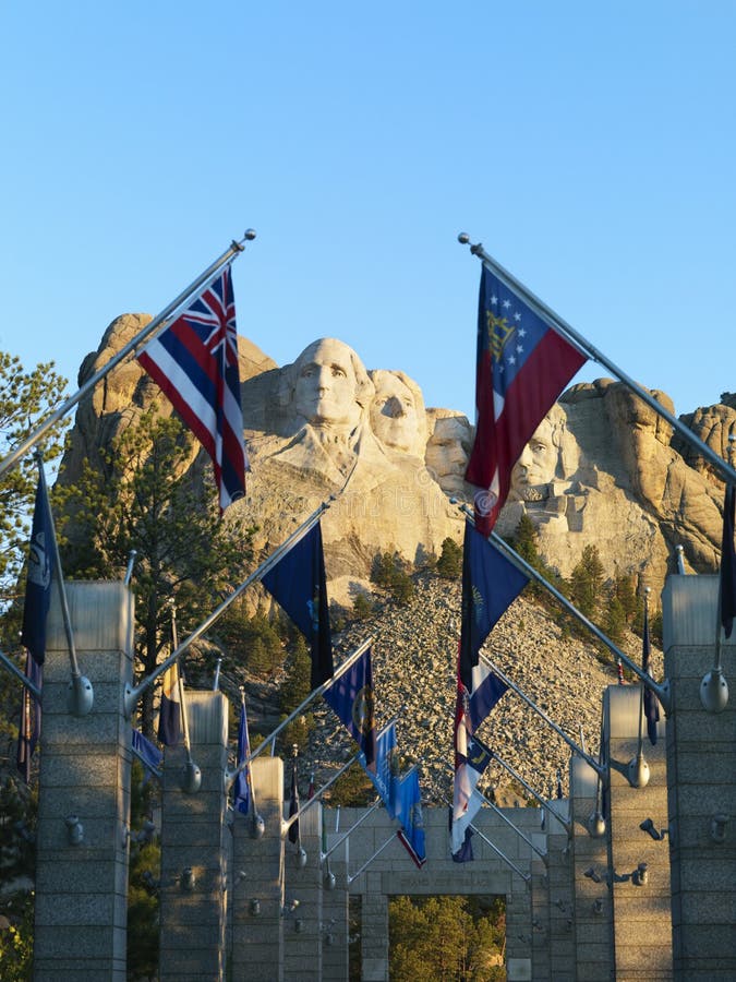 Mount Rushmore with flags. royalty free stock photos