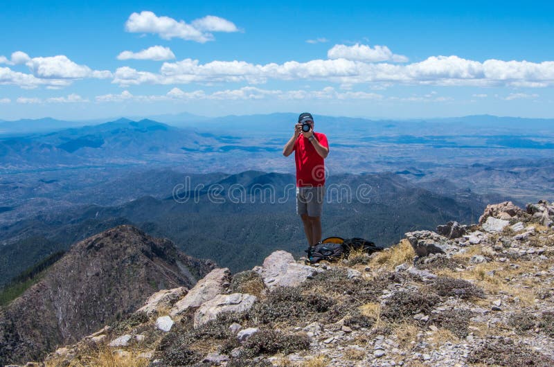 Mount Wrightson/USA - 11 May 2013: a photographer on top of the mountain