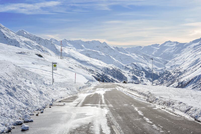Mountain asphalt road with a lot of snow on the side and mountain sk royalty free stock image Mountain asphalt road with a lot of snow on the side and mountain sk royalty free stock image