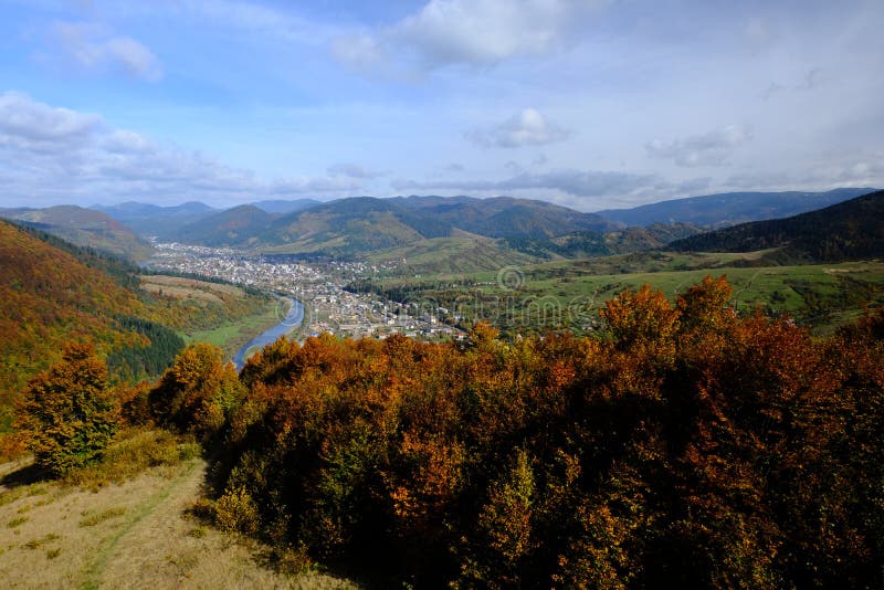 Mountain autumn landscape, view from ski elevator to small town stock images Mountain autumn landscape, view from ski elevator to small town stock images