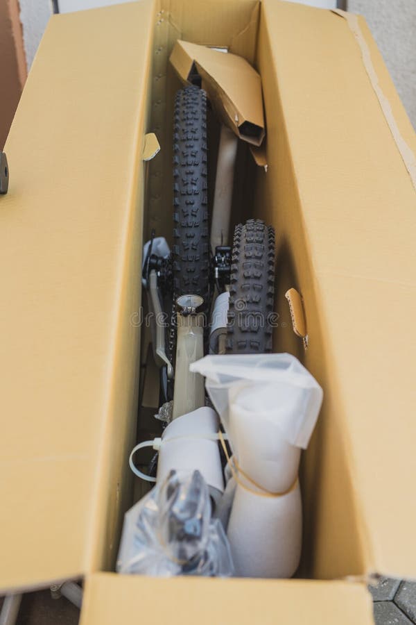 Mountain bike in a cardboard box. Parts of a bicycle ready to be assembled, the process of unboxing