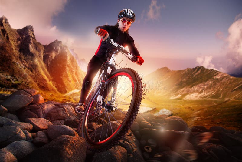 mountain bike cyclist riding single track at sunrise healthy