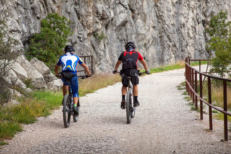 Mountain Bike cyclist riding track stock photo Mountain Bike cyclist riding track stock photo