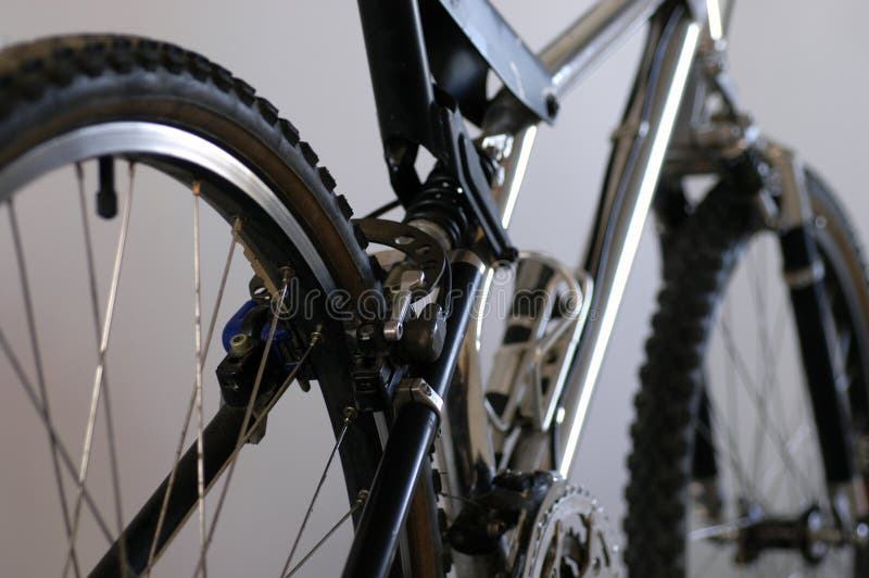 Partial view of a classic mountain bike from above the rear wheel. Partial view of a classic mountain bike from above the rear wheel