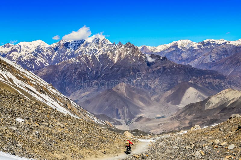 Mountain biker in Himalayas mountains