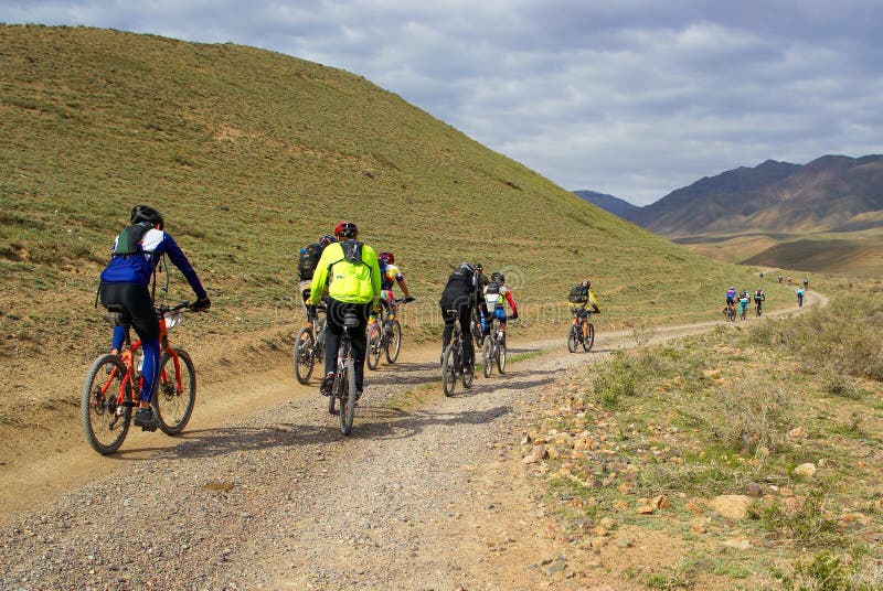 Mountain bikers group racing in desert