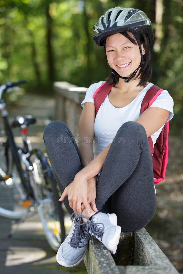 Mountain biking woman with bike enjoys summer vacation royalty free stock photo Mountain biking woman with bike enjoys summer vacation royalty free stock photo