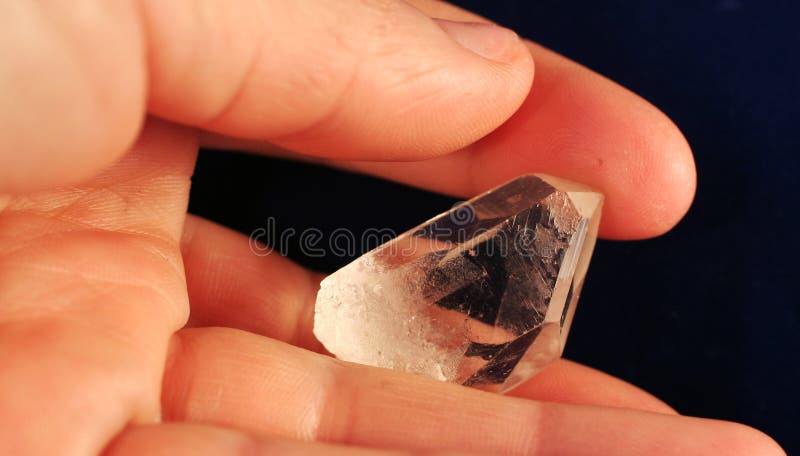 Mountain crystal in hand stock photos