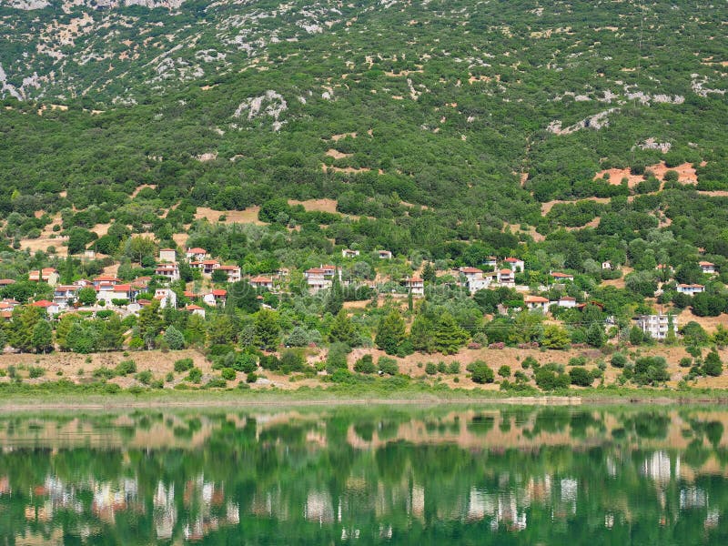Mountain Greek Village Reflected in Lake Water royalty free stock photography Mountain Greek Village Reflected in Lake Water royalty free stock photography