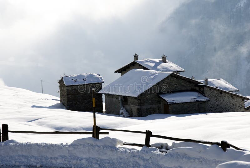 Mountain hut under snow