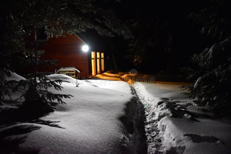 Mountain hut in winter evening scene