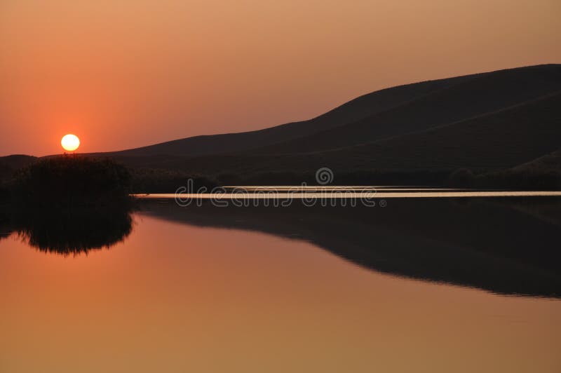 Mountain lake, sunset. Beautiful landscape. Serene beach atmosphere stock images, royalty-free photos and pictures