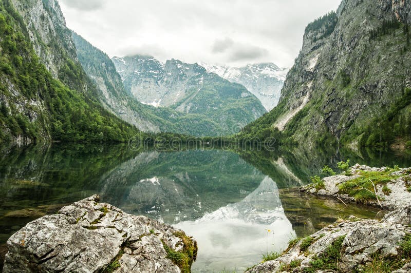 Mountain lake, reflection of the mountains around.